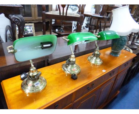 THREE READING LAMPS, table lamp with shade and a stoneware pot containing various umbrellas, pogo stick etc etc (5)