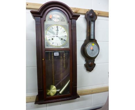 A MODERN MAHOGANY WALL CLOCK, (key and pendulum), and a small oak barometer (key) (2)