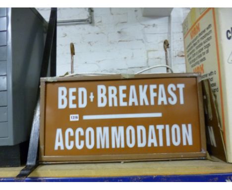 AN ELECTRIC WALL HANGING ADVERTISING SIGN, with bracket