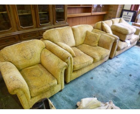 AN UPHOLSTERED FOUR PIECE SUITE, comprising of a three seater settee, two seater settee, armchair and a pouffe