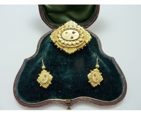 A CASED VICTORIAN 15CT GOLD RUBY AND DIAMOND SET, to include earrings and matching brooch, within original fitted box