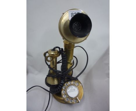 A BRASS CANDLESTICK TELEPHONE