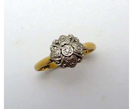 AN 18CT GOLD DIAMOND CLUSTER RING, with single cut diamond detail to the plain tapered band, stamped 18C and PLAT, ring size 