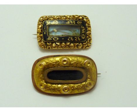 TWO MEMORIAL BROOCHES, the first with black enamel detail with personal inscription to the back, the second with panel of hai