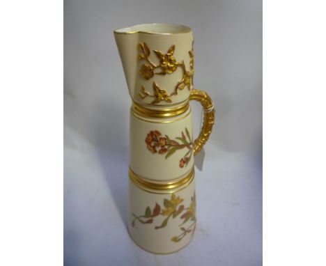 A ROYAL WORCESTER JUG, of tapering form with naturalistic gilt handle and coppered decoration, painted with flowers and blush