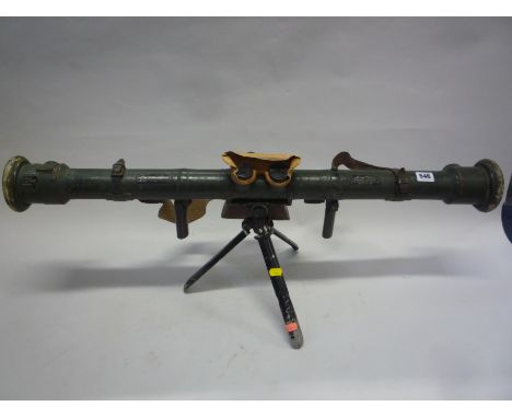 A BARR & STROUD WWI PERIOD RANGEFINDER, barrel form with folding handles and binocular scope, labelled and dated 1915 with br