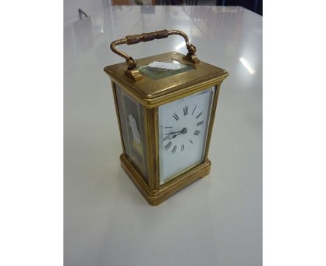 A BRASS CARRIAGE CLOCK, with key and winder