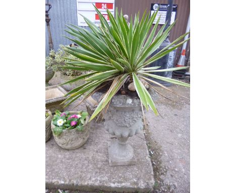 A COMPOSITE GARDEN PLANTER, on a separate stand