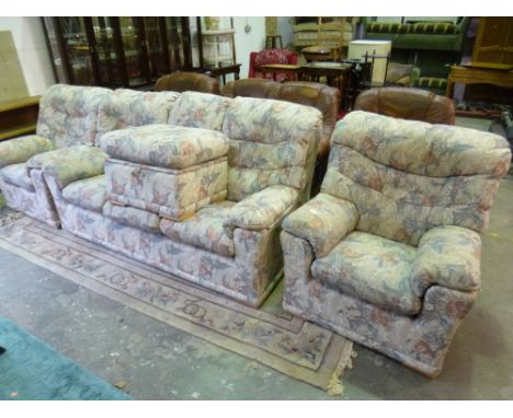 AN UPHOLSETERD G-PLAN FOUR PIECE SUITE, comprising of a three seater settee, pair of armchairs and a pouffe