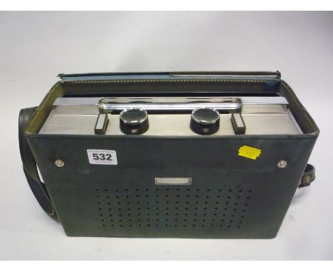 A DISCATRON PORTABLE 7' RECORD PLAYER, pressed chromium and plastic within a black leatherette carry case, 19cm high, 32cm wi