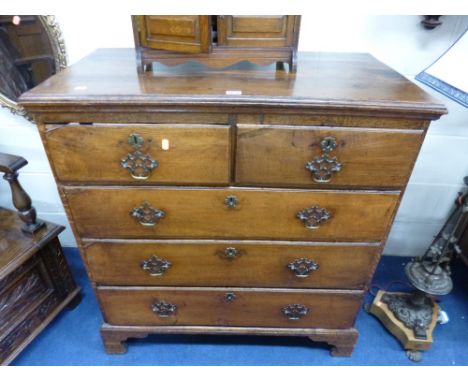 A GEORGIAN OAK CHEST, of two short and three long drawers on bracket feet supports