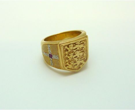 A DIAMOND AND RUBY RING, with three lions shield detail and St George cross diamond side, stamped 9ct, ring size