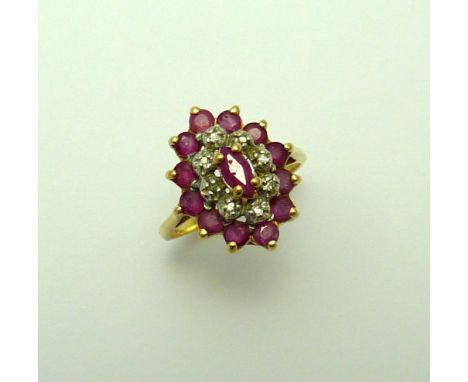 A 9CT GOLD RUBY AND DIAMOND RING, with central marquise shape ruby within a surround of diamond accents and further ruby boar