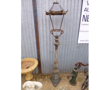 A CAST IRON STREET LAMP