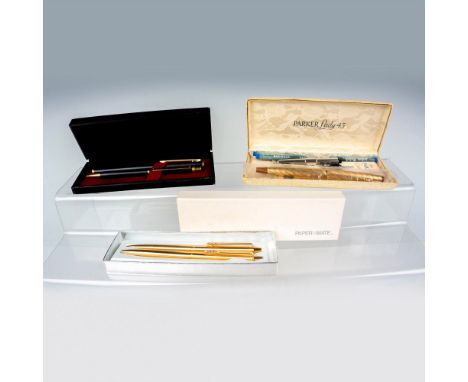A set of 3 boxes of different brands of writing utensils, Paper Mate, Sissy Halprin, and Parker Lady 15. The Paper Mate box c