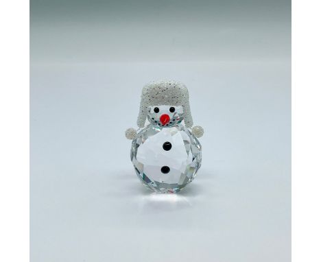 An adorable figure of a small clear crystal snowman wearing a sparkling crystal cap. Swarovski marked. This item has its orig