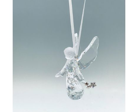 Part of the Season collection. A angelic tree ornament of an angel made from clear and matt crystals. She is holding silver-t