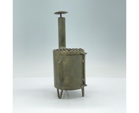 Adorable handmade miniature version of a wood-fired stove crafted in brass with a grate top. Dimensions: 4.5"L x 3"W x 8"HCon