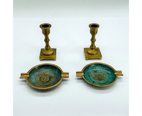 Two miniature brass Judaica candlesticks and two miniature ashtrays with a teal marbled enamel finish and engraved designs. C