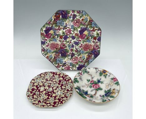 Introducing three intricately decorated plates, all crafted in England, with two pieces hailing from Crown Ducal ware and the