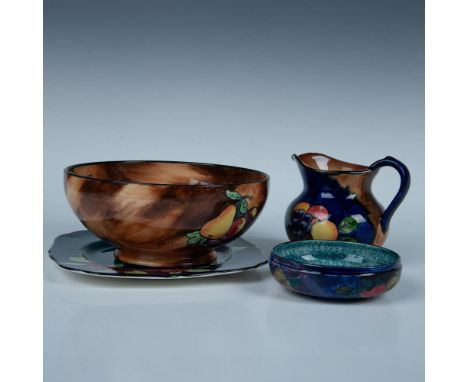 This collection features a small Rubens ware bowl, adorned with exotic fruits against a cobalt blue background with a mottled