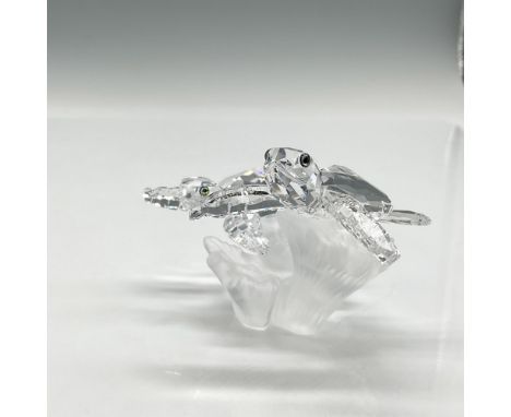 Part of the Aquatic Worlds theme group. Clear faceted crystal figures with azure crystal eyes swimming over satin crystal cor