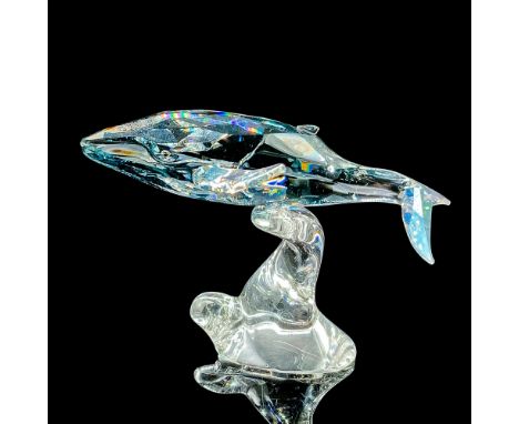 Small humpback whale made with blue/grey and clear crystal. Item includes original box measuring 7"L x 7"W x 4.75"H. Artist: 