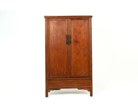 A LARGE CHINESE WOODEN CABINET
Of slightly tapered form with a panelled lower section on square supports, and vase shaped han