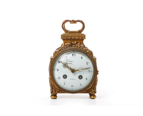 A FRENCH ORMOLU PENDULE D'OFFICIER CLOCK
Early 20th Century
The case with foliate loop handle, laurel wreathes and acanthus d