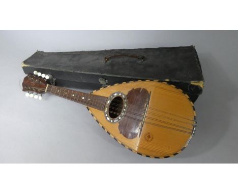 An Italian Cased Mandolin Stamped 'R. Porto + Figli Catania' 