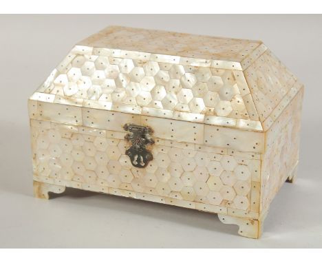 AN INDIAN GOA MOTHER OF PEARL CASKET, with hinged lid and raised on four bracket feet, 20cm wide.