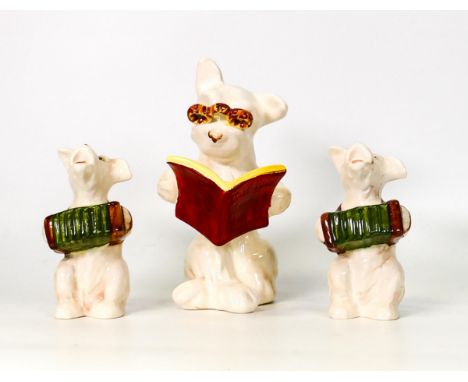 Three Beswick figures to include Dog With Glasses Reading A Book 831 together with two Dog Playing Accordion 811 