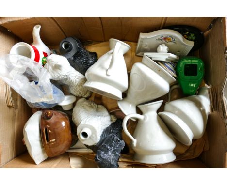 A collection of Wade Jugs , Money Box, Door Plaques etc  .These items were removed from the archives of the Wade factory and 