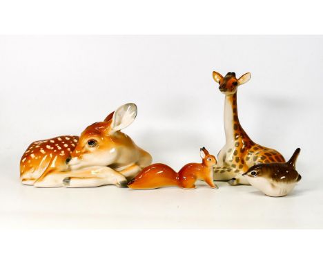 A collection of Russian ceramic figures to include large seated deer, giraffe, small squirrel and a wren (4) 