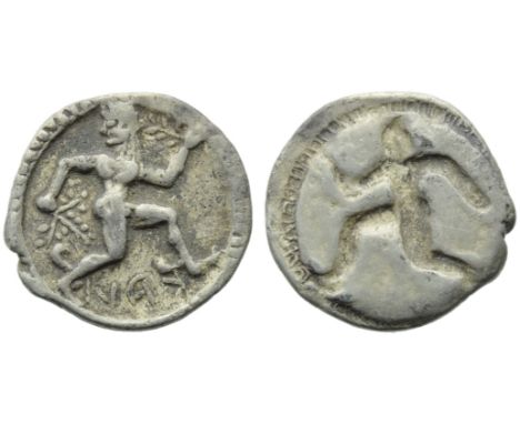 Bruttium, Caulonia, Obol, c. 525-500 BC; AR (g 0,49; mm 10; h 12); KAV (retrograde), daimon running l., head r., holding bran
