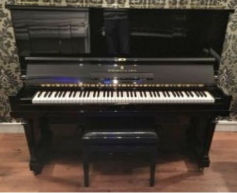 Steinway (c1928) A Model K upright piano in a bright ebonised case.  This piano has been completely restored.  AMENDMENT (c19