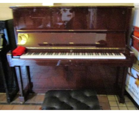 Steinway (c2003)A Model K upright piano in a bright mahogany case; together with an adjustable stool with black leather top.