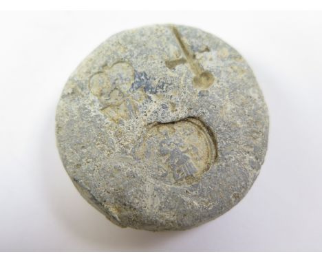 Lead Weight, found Suffolk, with three punch marks, upright dagger/sword, a gentleman standing facing, holding a pair of scal