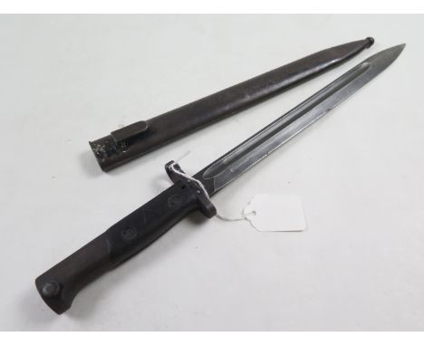 Bayonet: Belgian F.N. Export Mauser bayonet (long blade) In its steel scabbard. Worn condition.