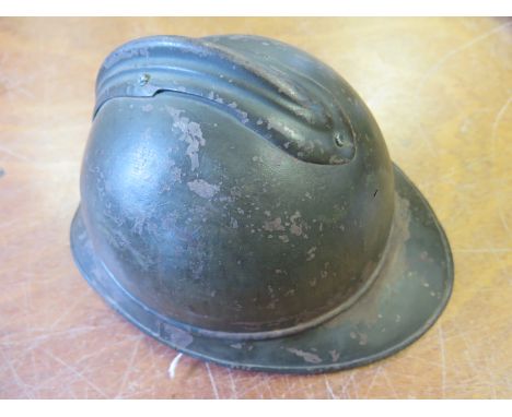 A Great War 'Adrian' Pattern Helmet shell lacking liner and RF Badge. Some wear