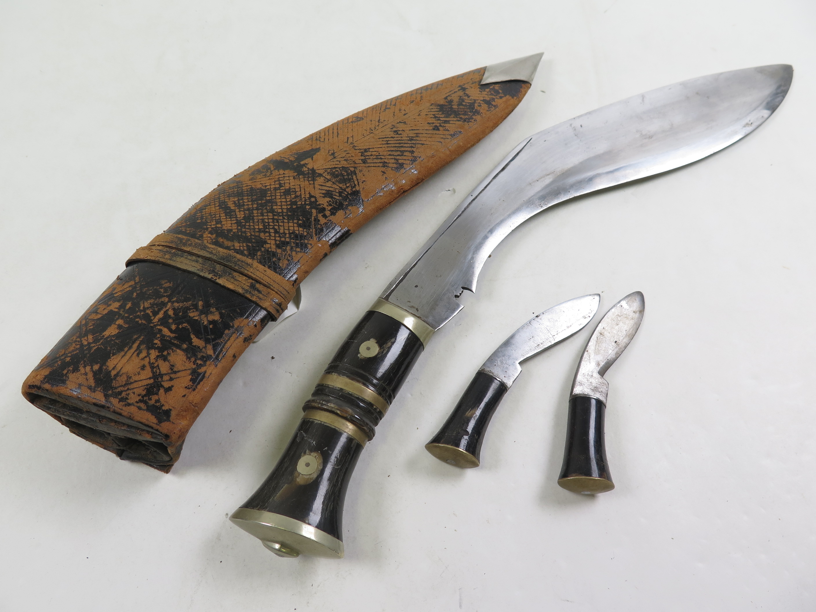 Knife A good quality Indian Kukri in its leather scabbard with two