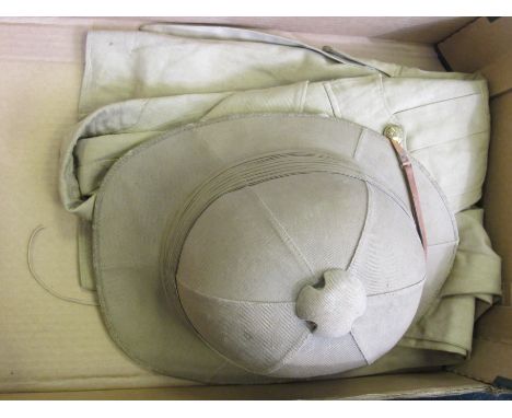 British Officers Tropical Tunic and Helmet issued to a Captain of the 7th Rajput Regiment. All buttons and insignia are origi