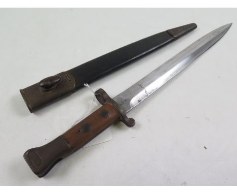 Bayonet: A Pattern 1888 MKI Bayonet in its steel mounted leather scabbard. Ricasso WD marked & dated 4.90. Good blade. Sound 