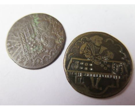 German brass jetton of the 16th. century, depicting what looks like Henry VIII at his accounting board, reverse depicts the a