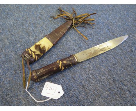 African knife blade 7". Leather hilt with leather and hide scabbard. 