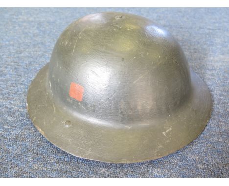 Great War ' Raw Edge' British Brodie Helmet with oilskin liner and leather chinstrap. Over painted (possibly contemporary?) w