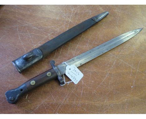 Pattern 1888 Boer War Lee Enfield Bayonet in its steel mounted leather scabbard. Ricasso marked '5-00' and 'EFD'. Worn but so
