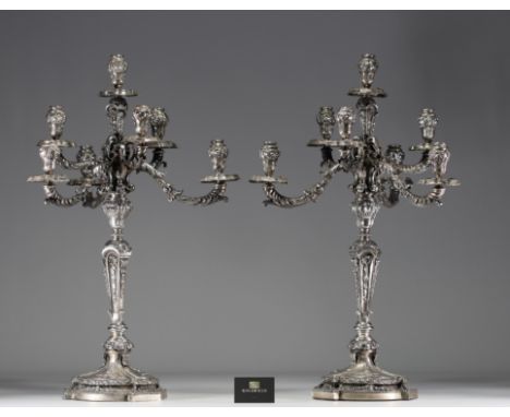An imposing pair of Louis XVI solid silver candelabras with seven points of light, richly decorated with acanthus leaf and sh