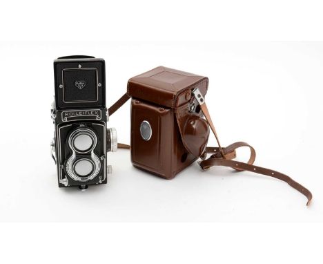 A Rolleiflex T twin-lens reflex camera, serial no. T2163671, fitted a Tessar 75mm f3.5 lens, in leather case and original box