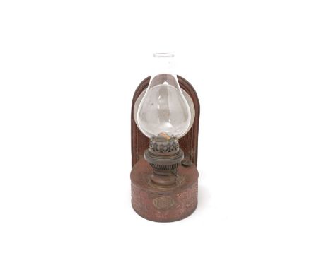 A North Eastern Railways wall mounting oil lamp, painted red with NER plaque, 31cms high including chimney.